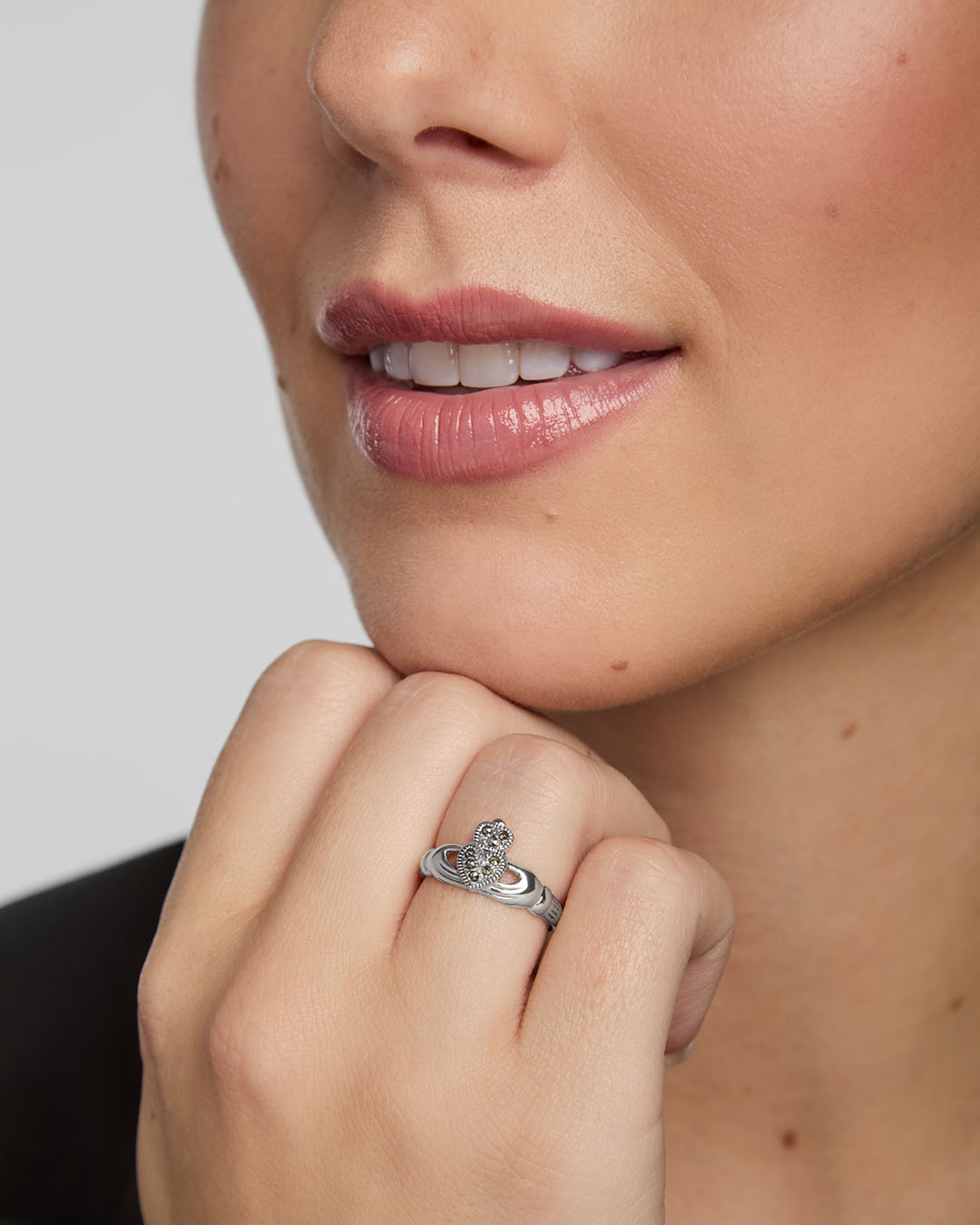 close-up image of a woman wearing marcasite claddagh ring from Solvar