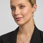 matching trinity knot necklace and earrings on a female model