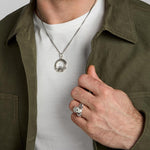 oxidised silver men's heavy Celtic Claddagh ring and matching necklace set on a model