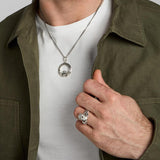 oxidised silver men's heavy Celtic Claddagh ring and matching necklace set on a model
