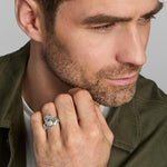 a model wearing men's heavy silver Celtic Claddagh ring from Solvar