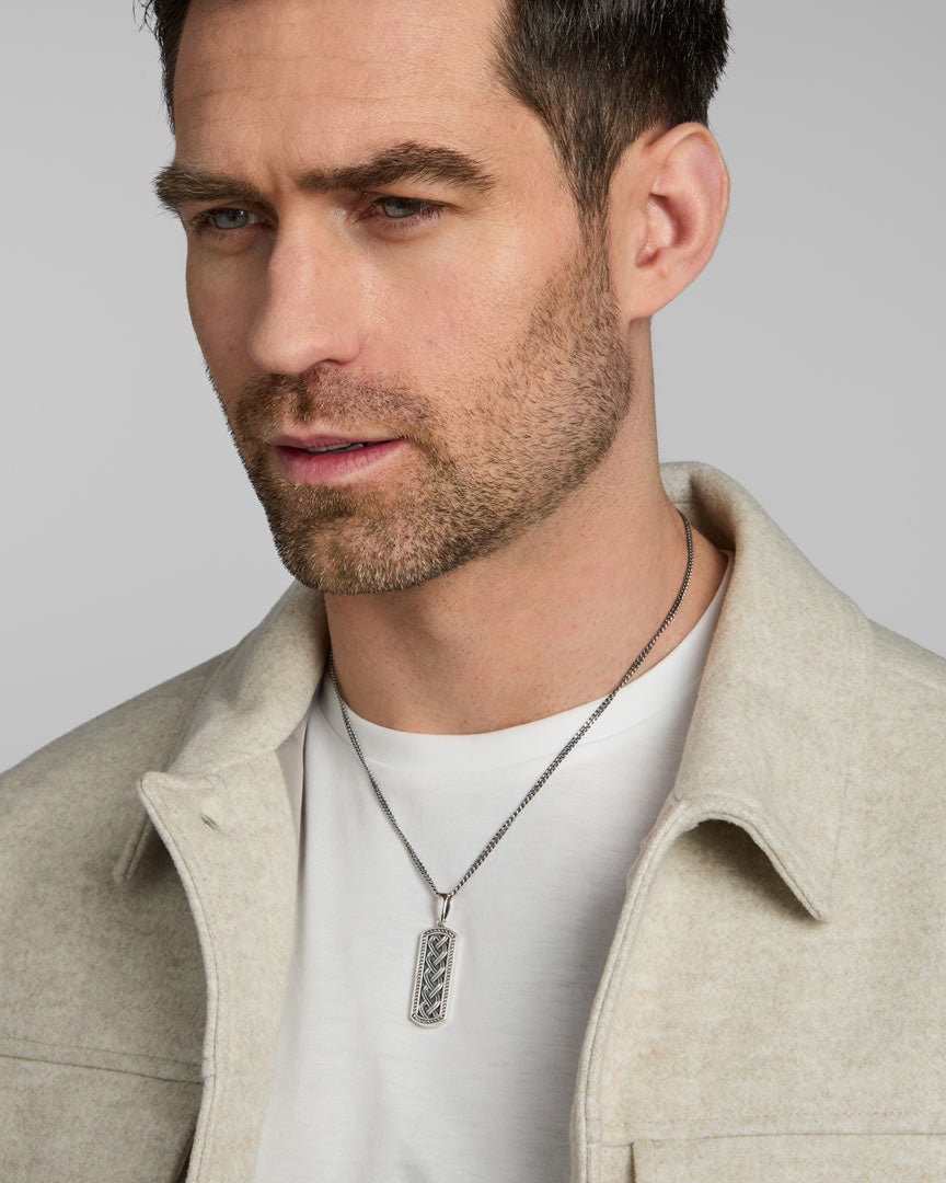 a male model wearing silver Celtic Knot ingot pendant from Solvar