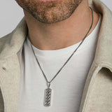 men's oxidised silver Celtic knot ingot pendant on a model