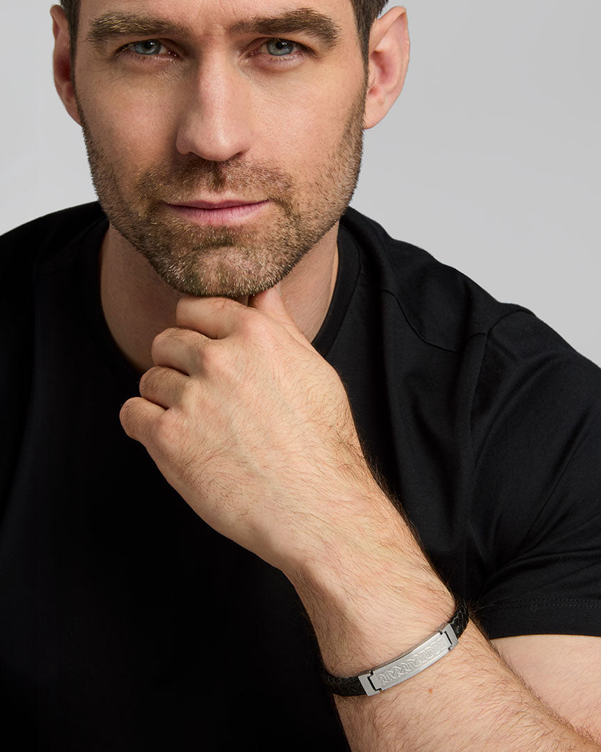 a male model wearing Celtic Knot black leather bracelet from Solvar