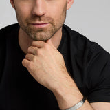 a male model wearing Celtic Knot black leather bracelet from Solvar