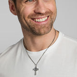 a male model wearing oxidised silver Celtic cross necklace from Solvar