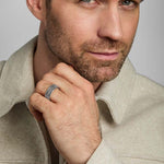 a male model wearing oxidised silver Celtic Knot band ring from Solvar