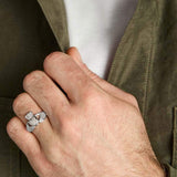 closeup image of mens silver claddagh ring on a model