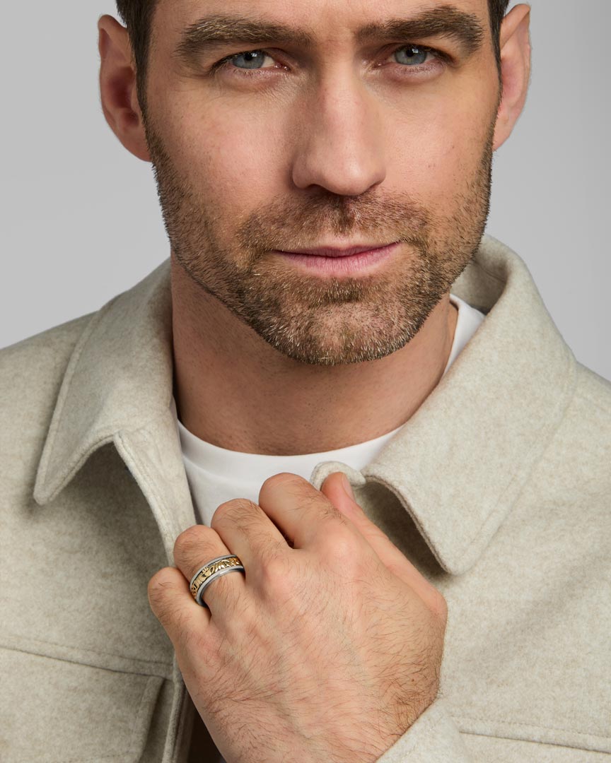 male model wearing gold and silver Claddagh band ring from Solvar
