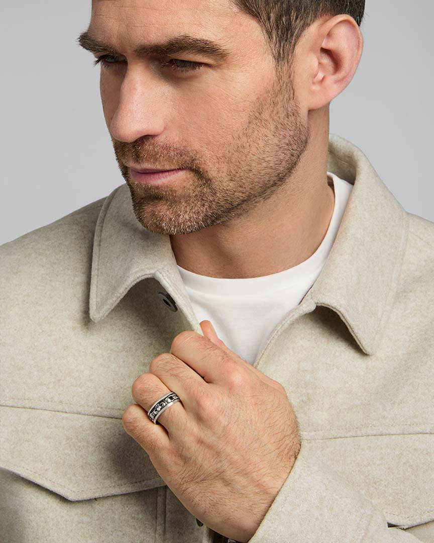 a male model wearing oxidised silver claddagh band ring from Solvar