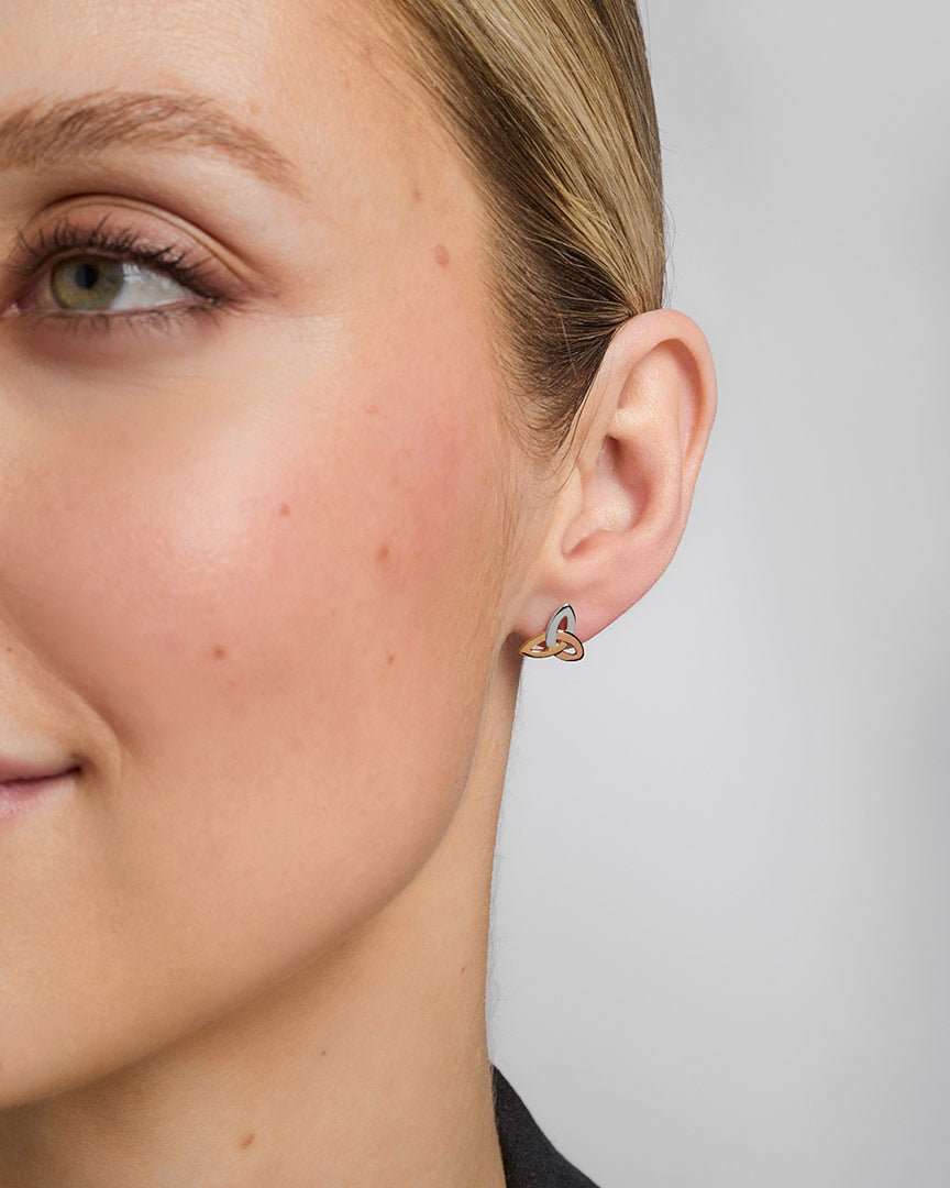 14K gold multi tone gold trinity knot stud earrings s33136 on a model 2