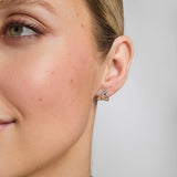 14K gold multi tone gold trinity knot stud earrings s33136 on a model 2