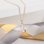 styled image of 14k gold multi tone gold colour trinity knot pendant s44529 from Solvar 