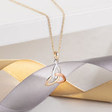 styled image of 14k gold multi tone gold colour trinity knot pendant s44529 from Solvar 