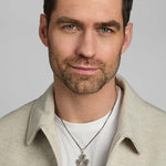 a model wearing men's silver Celtic Shamrock pendant on heavy silver chain from Solvar