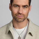 a model wearing men's silver Celtic Shamrock pendant on heavy silver chain from Solvar