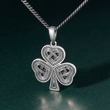 lifestyle image of oxidised silver Celtic Shamrock pendant for men