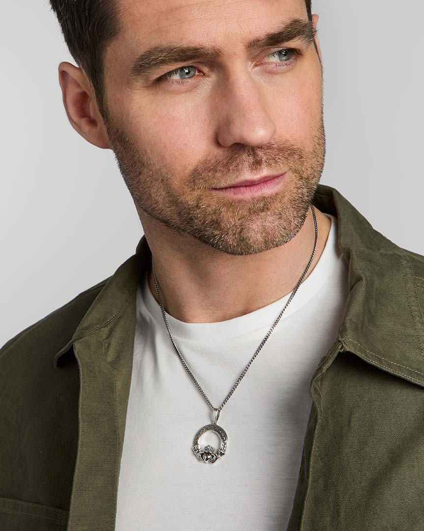 male model wearing silver Celtic Claddagh pendant from Solvar