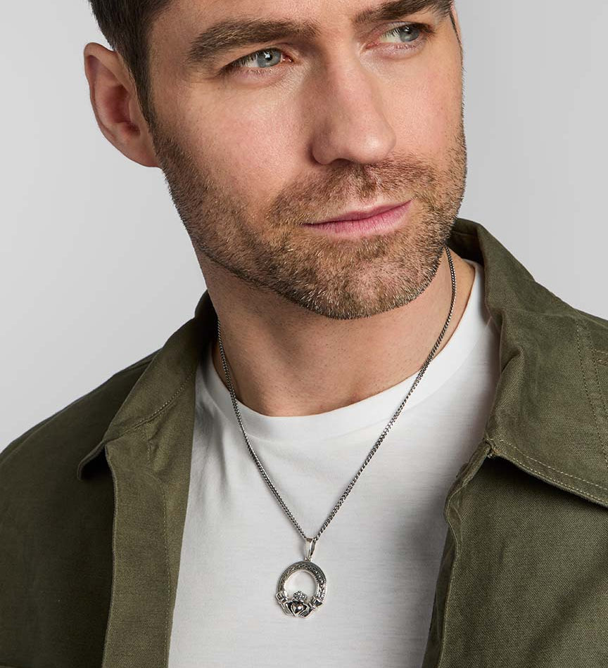 male model wearing silver Celtic Claddagh pendant from Solvar