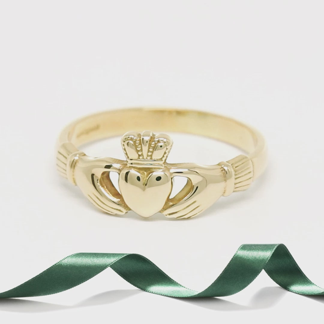 gold Claddagh ring  on the turnable able