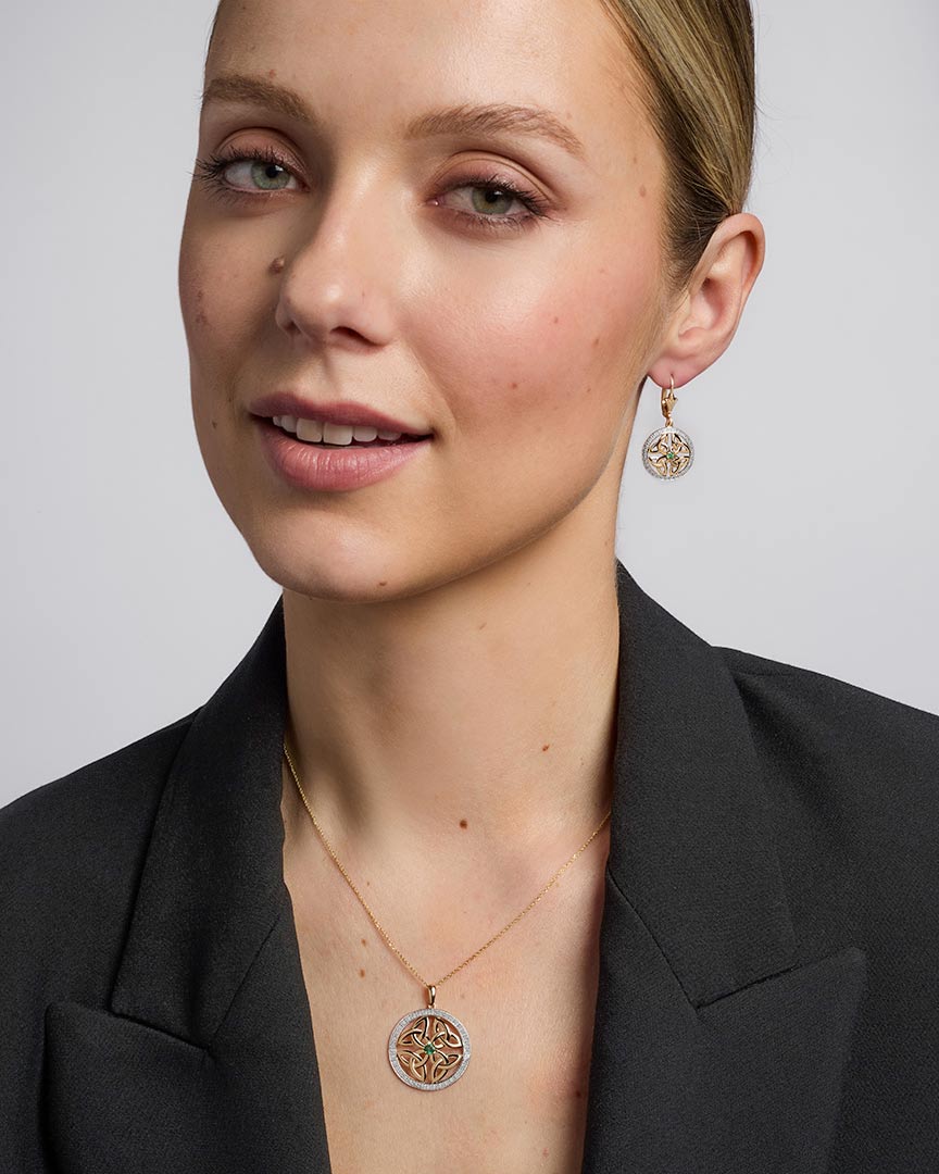 14K gold emerald round trinity knot earrings s33951 on a model 2
