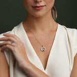 a model wearing September birthstone ring and necklace set