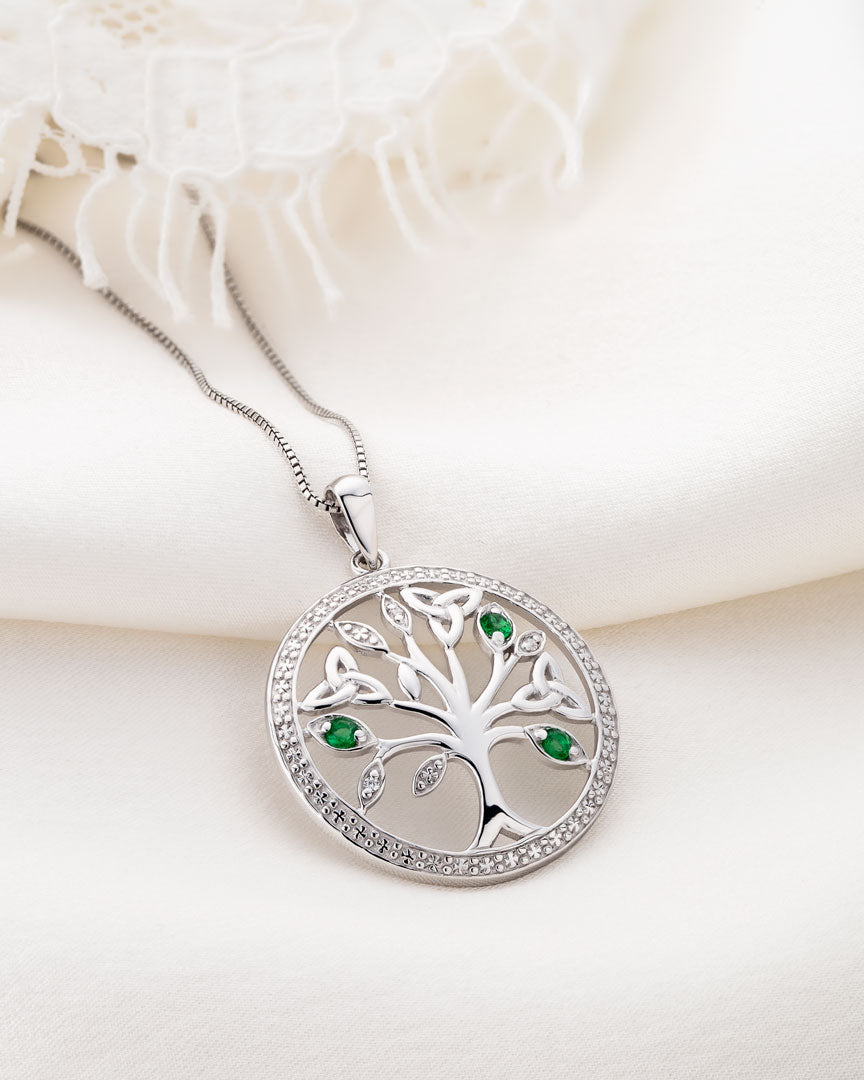 style image of silver Irish Tree of Life necklace on the light background 
