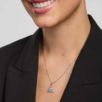 model wearing Solvar Trinity Knot pendant in silver