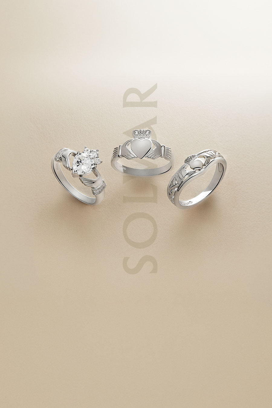 lifestyle image of silver Claddagh rings with Solvar logo at the background - mobile version