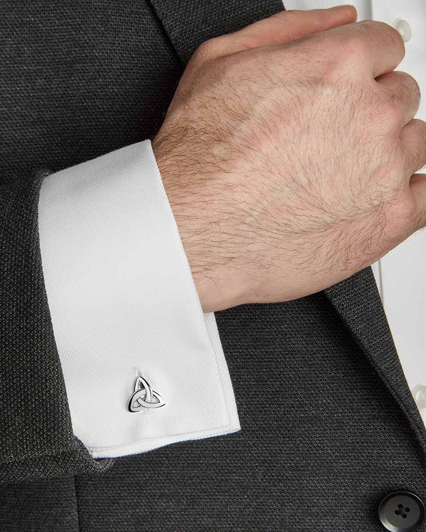 a model wearing silver trinity knot cufflinks from Solvar