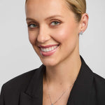 a female model wearing trinity knot jewellery set in silver