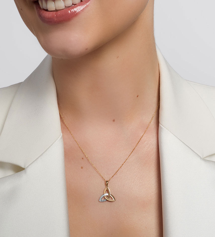 a model wearing yellow gold diamond trinity know pendant s46517