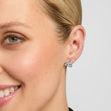 female model wearing traditional trinity knot stud earrings in silver