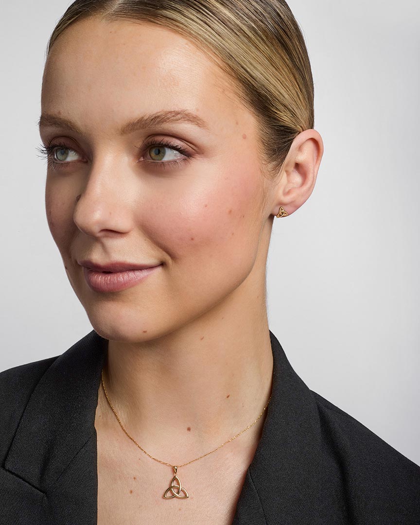 14K gold small trinity knot stud earrings s3077 on a model 2