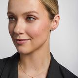14K gold small trinity knot stud earrings s3077 on a model 2