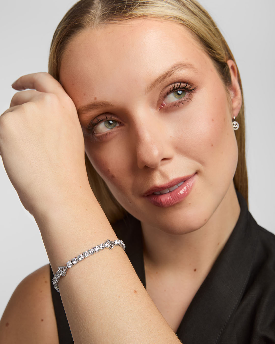 a woman wearing celtic cz tennis bracelet from Solvar