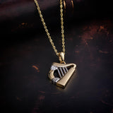 styled image of  two tone gold harp pendant s44063