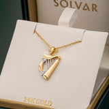 two tone gold harp pendant s44063 in a branded solvar jewellery box