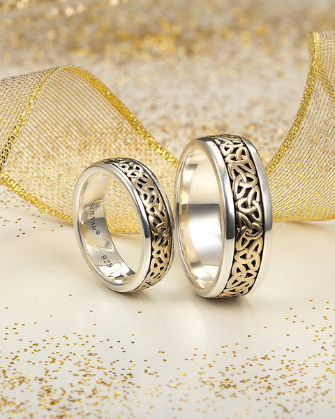 lifestyle image of two trinity knot wedding bands