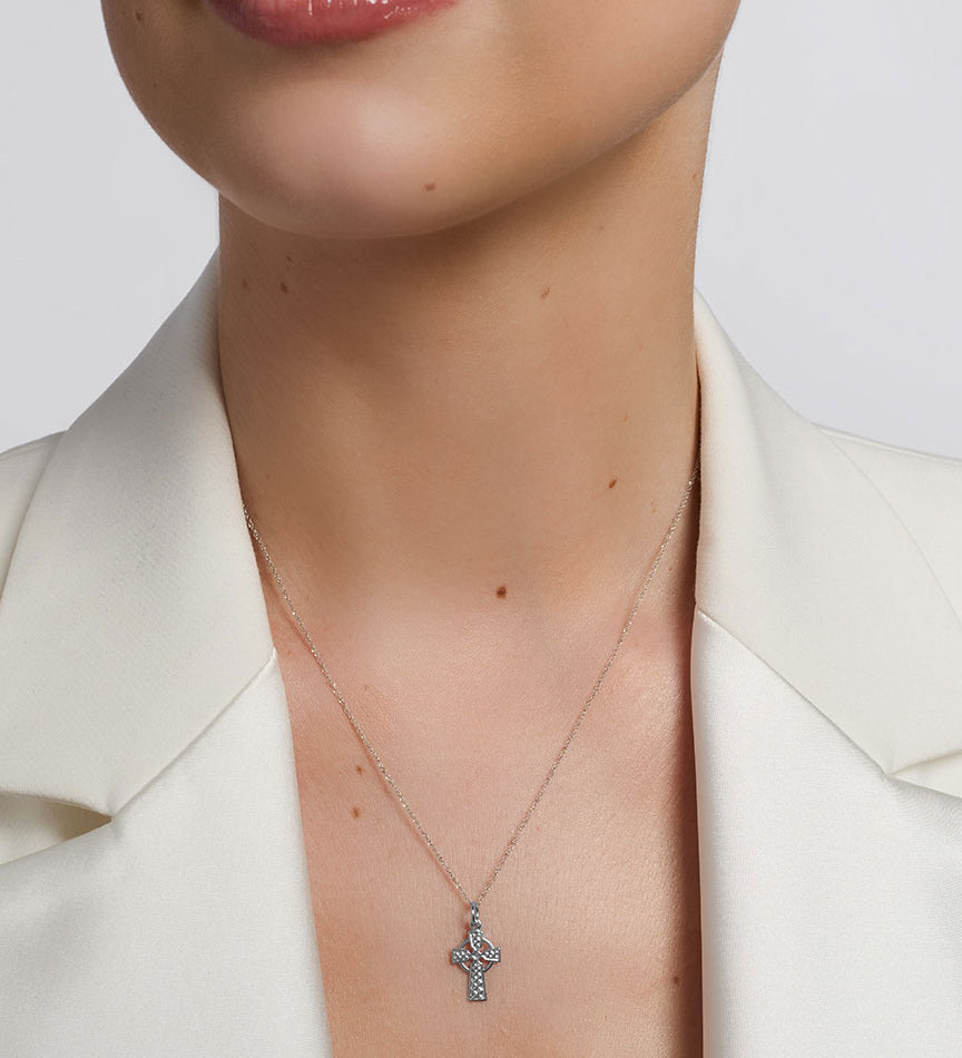solvar white gold small celtic cross necklace on a model