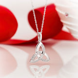 styled image of 14k white gold diamond trinity knot pendant s44415 from Solvar 2
